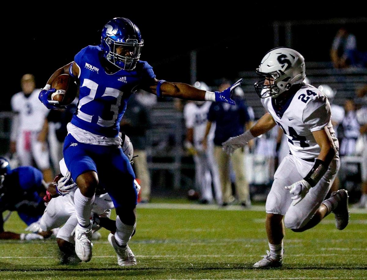 Nolan running back Sergio Snider (23) tries to elude All Saints defensive back Frederick Hunkeler (24) during the first half of a high school football game, October 16, 2020 played at Doskocil Staduim at Nolan High School in Fort Worth, Tx. (Steve Nurenberg Special to the Star-Telegram)