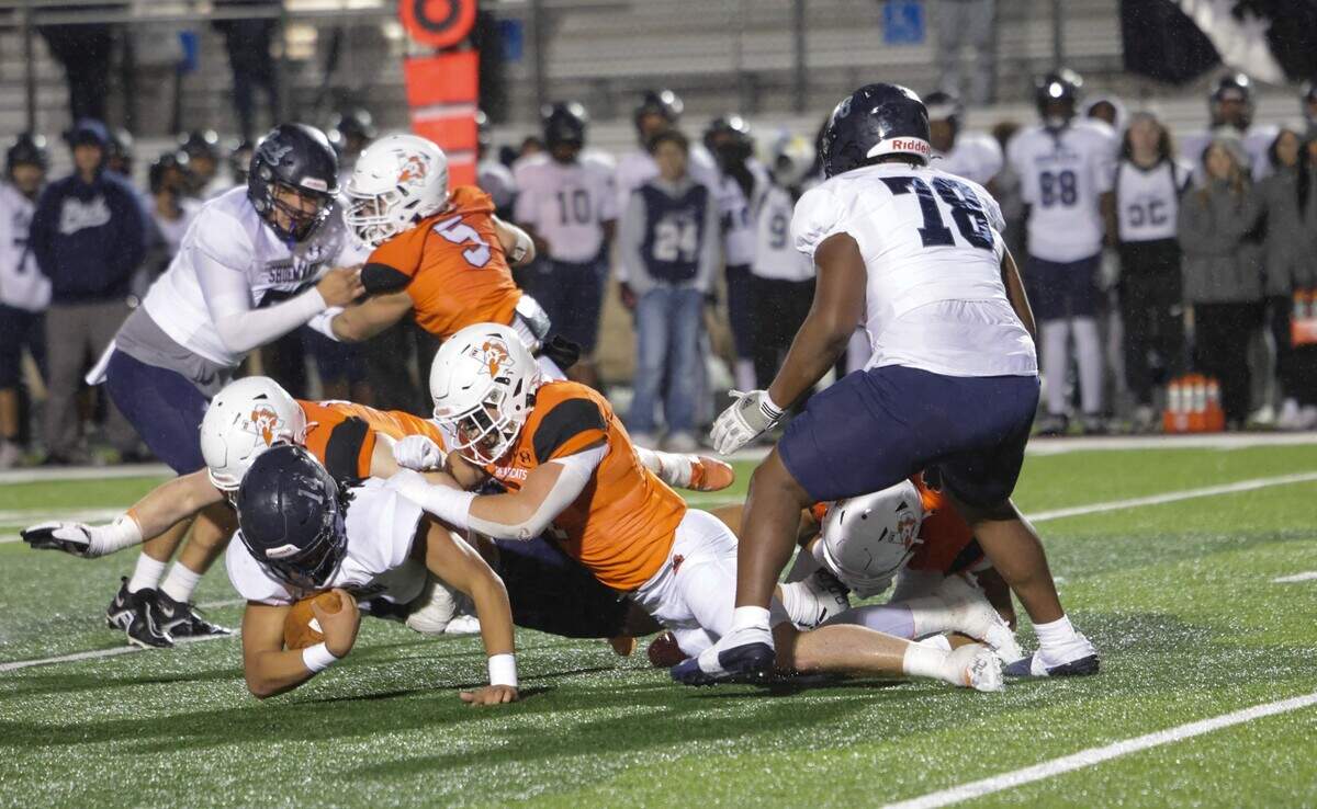 Aledo’s Cooper Kohan and Decker Sanders bring down Killeen Shoemaker’s Isaiah Butler-Tanner in a Class 5A Division 1 bi-district game on Thursday, November 9, 2023 at Buchanan Stadium in Aledo, Texas.