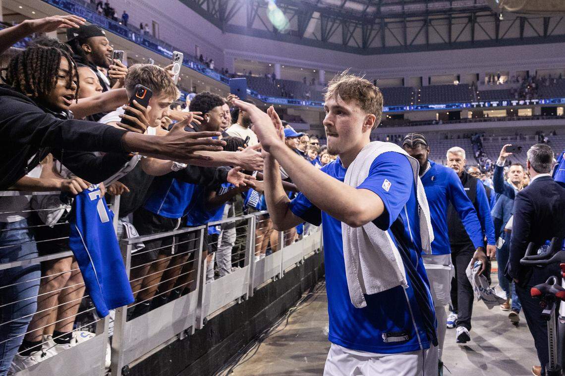 Mavericks forward Cooper Flagg (32) greets fans following the second half of a preseason NBA game between the Dallas Mavericks and Oklahoma City Thunder at Dickies Arena in Fort Worth on Monday, Oct. 6, 2025.