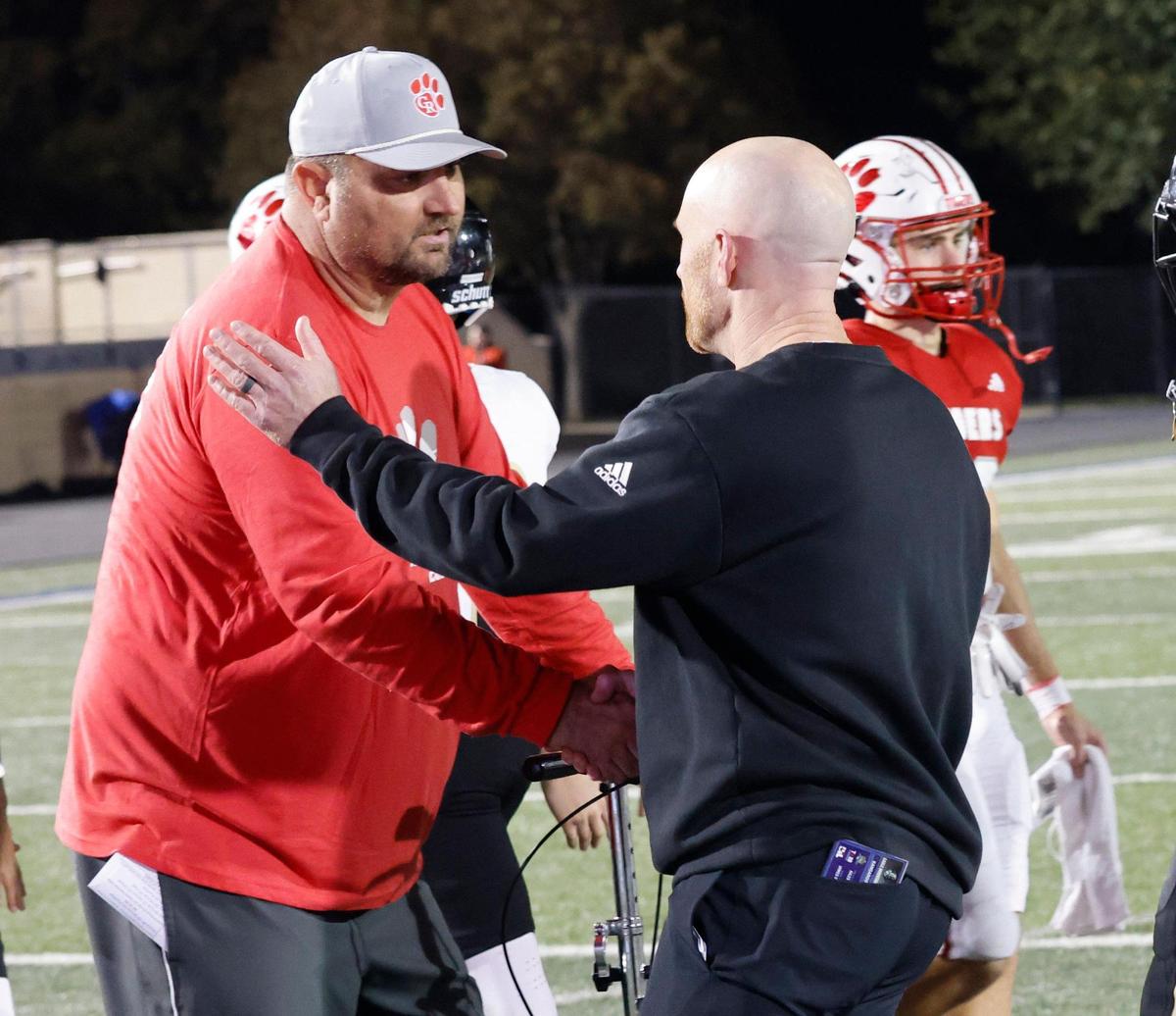 Glen Rose head coach Cliff Watkins and Eagle Mountain head coach Jeremy Mullins meet at mid field after an UIL 4A D2 Region 1 Bi-district football playoff game at Kangaroo Stadium in Weatherford, Texas, Friday, Nov. 15, 2024.