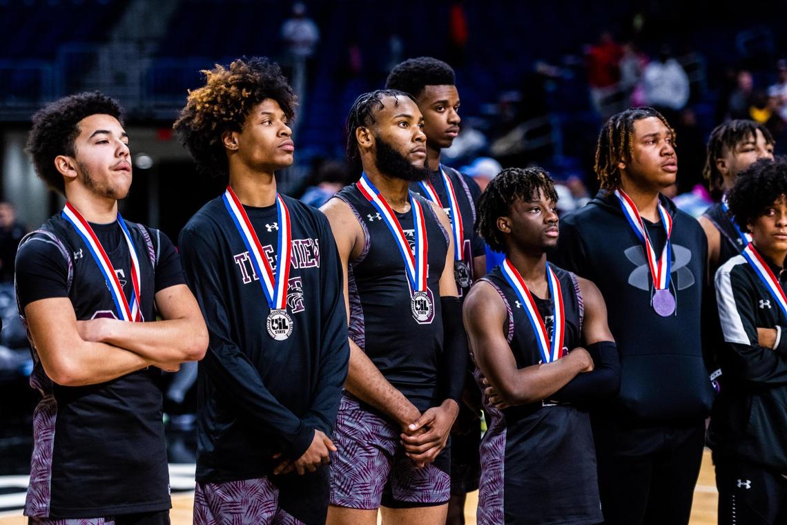 The Timberwolves look on while Beaumont United receives their championship trophy after losing 62-57 in the 5A state final game in San Antonio, at the Alamodome, on March 12, 2022. Beaumont United won 62-57.