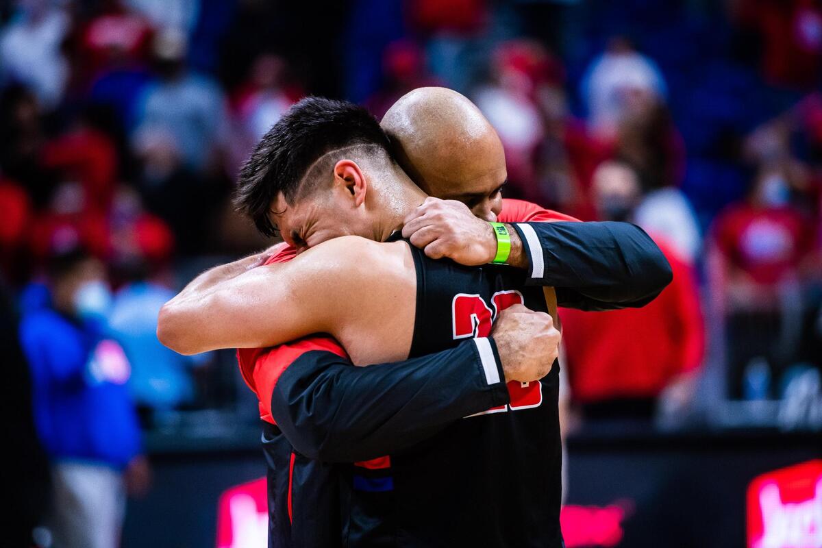 David Peavy and Juan Reyna (20) hug after Duncanville beat Austin Westlake 66-53 in the 6A state final at the Alamodome in San Antonio Texas, on March 13, 2021. (Photo by Matt Smith. Special to the Star-Telegram).