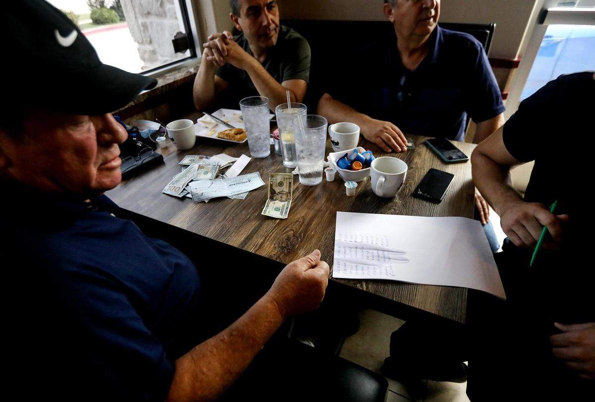 Businessmen from the Albanian community pool donations for Fort Worth Police Officer Matthew Brazeal during a fundraiser at Cafe Republic on Monday, June 29, 2020. Brazeal was struck by a driver fleeing apprehension on June 13, police said. The group raised over $2,650 for Brazeal during the fundraiser. Total donations, excluding sales from T-shirts, were more than $6,330, police said.