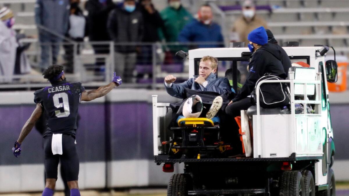 TCU cornerback C. J. Ceasar (left) approaches Louisiana Tech quarterback Luke Anthony for a virtual fist bump during the second half of a NCAA football game at Amon G. Carter Stadium in Fort Worth, Texas, Saturday, Dec. 12, 2020. TCU defeated Louisiana Tech 52-10.
