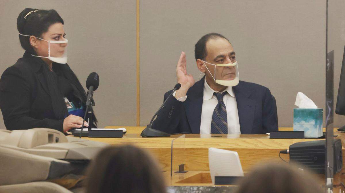 Yaser Said, 65, right, accused of killing his two teen daughters on New Year’s Day 2008, takes the stand to testify with the help of a translator Monday, Aug. 8, 2022, during his capital murder trial at the Frank Crowley Courts Building in Dallas.