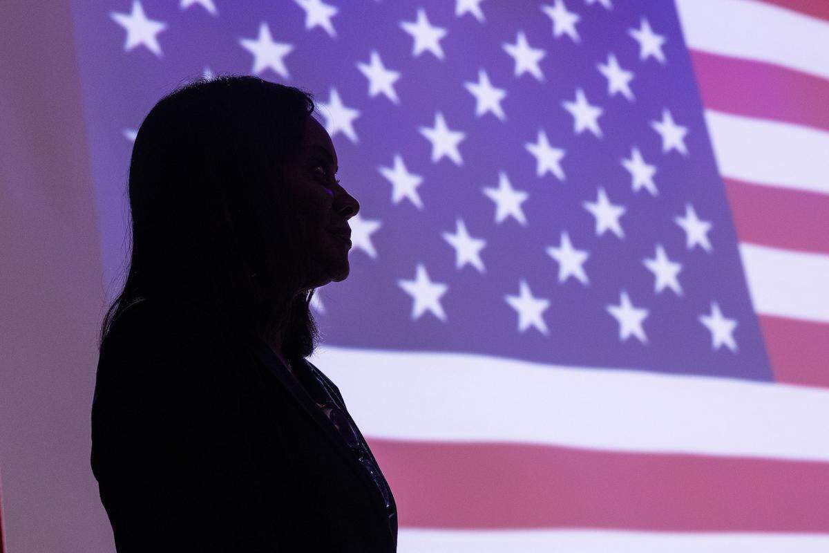 Alisa Simmons, the Tarrant County commissioner of Precinct 2, sits on stage as U.S. Rep. Marc Veasey, D-Texas, speaks to the capacity crowd during ‘The People vs. The Power Grab’ rally at the Ridglea Theater in Fort Worth on Saturday, Aug. 9, 2025.