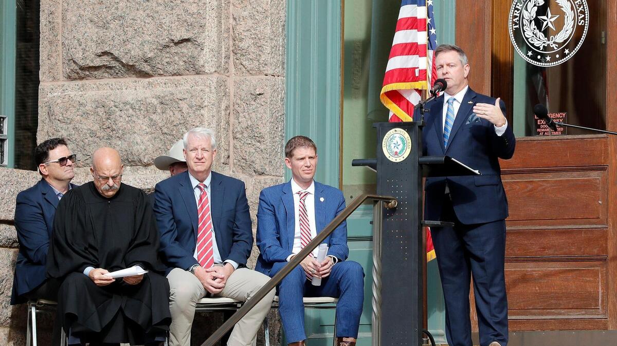 Tim O’Hare addresses the crowd after being sworn in as Tarrant County judge on the steps of the Courthouse in Fort Worth, Texas, Sunday, Jan. 1, 2023. O’Hare rescinded the county’s COVID-19 disaster declaration Friday in one of his first acts as county judge.