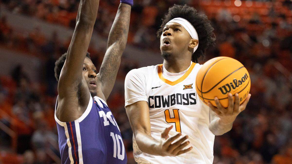 TCU’s Damion Baugh (10) guards Oklahoma State’s Woody Newton (4) square off in the first half of an NCAA college basketball game in Stillwater, Okla., Saturday, Feb. 4, 2023. (AP Photo/Mitch Alcala)