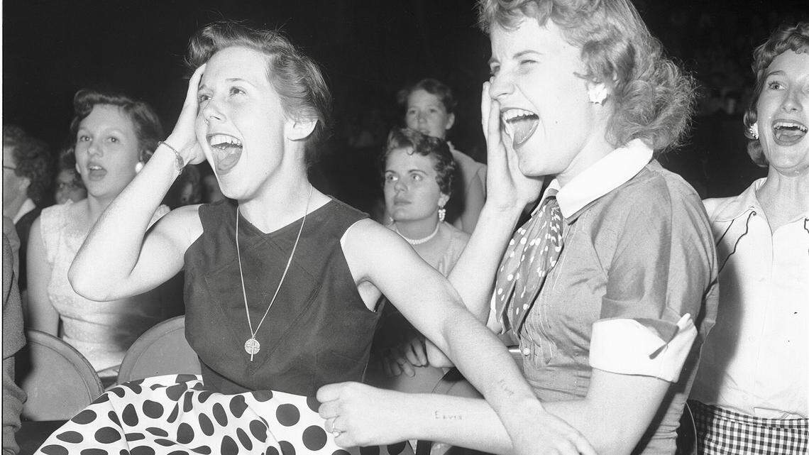 Two high school students from Dallas with “Elvis” carved into their arms at Elvis’s performance at the Fort Worth North Side Coliseum, April 20, 1956: Georgiana Blaylock, left, and Dolores Orms, both 16.