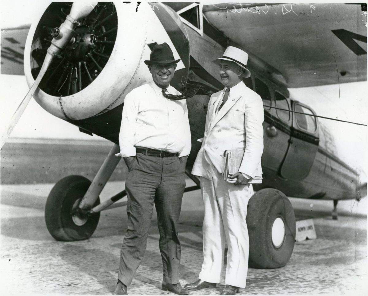 Will Rogers, left, and Amon Carter Sr.