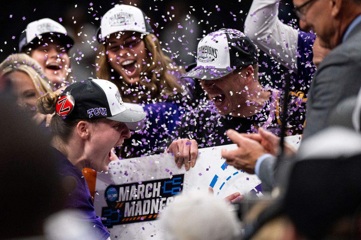 TCU Horned Frogs center Sedona Prince (13) and head coach Mark Campbell celebrate after defeating the Baylor Lady Bears at T-Mobile Center.
