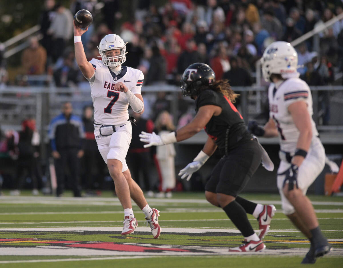 Allen quarterback Brady Bricker (7) throws the ball towards an intended receiver during a UIL football playoff game against Euless Trinity High School at Dragon Stadium in Southlake, Texas on Friday, Nov. 29, 2024.