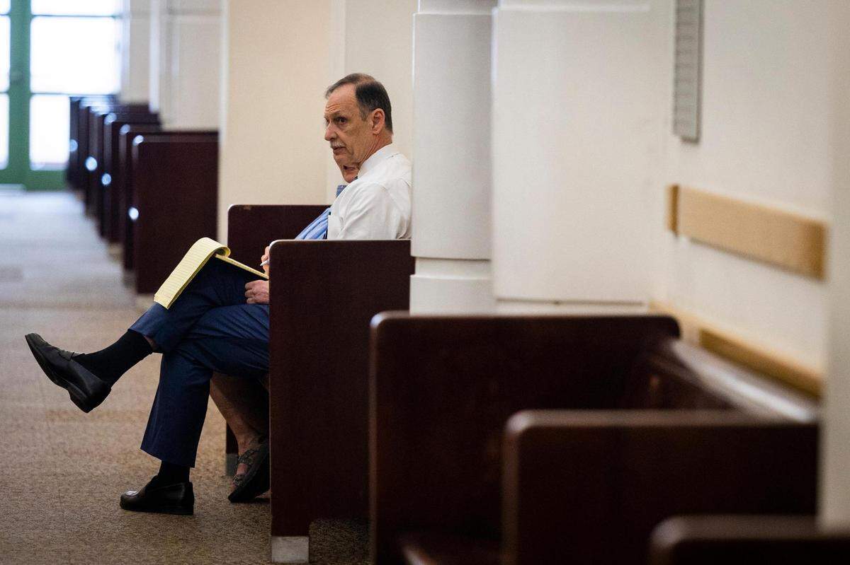 Defense attorney Bob Gill sits in the hallway before a recusal hearing on Judge David Hagerman’s status in the Aaron Dean case Thursday, June 23, 2022, in Fort Worth.