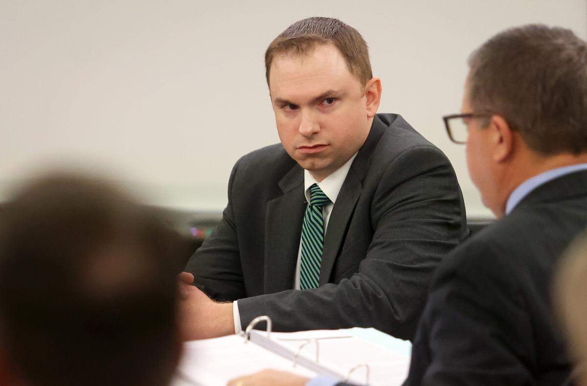 Former Fort Worth police officer Aaron Dean looks toward his attorneys during the second day of his murder trial on Tuesday, Dec. 6, 2022, in Fort Worth. Dean fatally shot Atatiana Jefferson in 2019 through a window at her home.