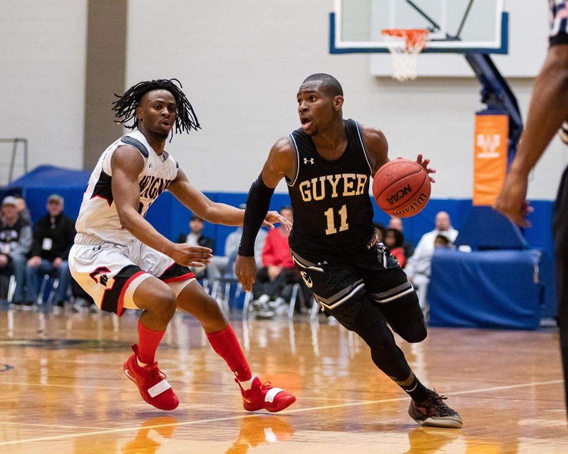 Denton Guyer senior guard De’Vion Harmon, right
