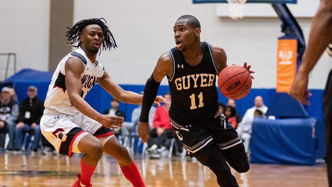 Denton Guyer senior guard De’Vion Harmon, right