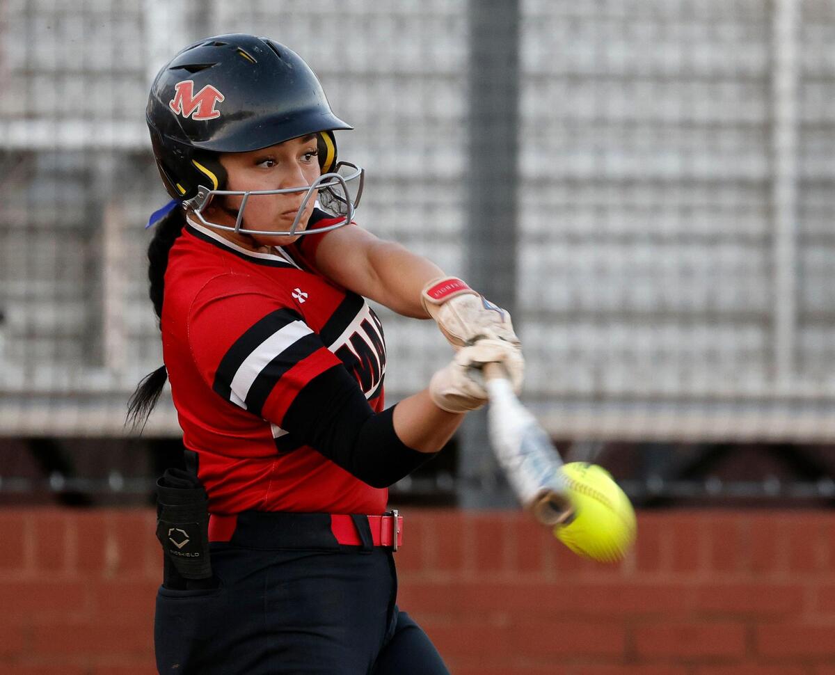 Arlington Martin short stop (4) Izabella Martinez hit a 2 RBI double on Tuesday to power the Warriors past Arlington Bowie.