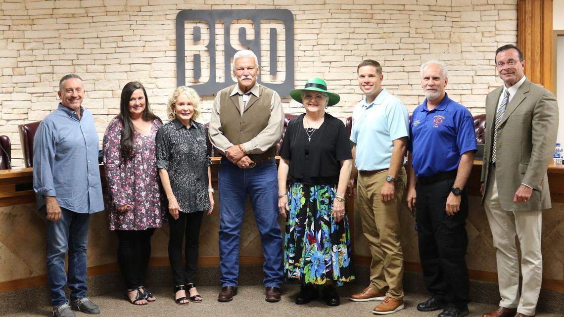 Burleson ISD Board of Trustees approved the hiring of 30-year Fort Worth Police Department veteran Curt Brannan as its first School Safety Officer. Pictured left to right: Trustee Andy Pickens, President Staci Eisner, Secretary Jerri McNair, School Safety Officer Curt Brannan, Trustee Pat Worrell, Vice President Ryan Richardson, Trustee Michael Ancy, and BISD Superintendent Dr. Bret Jimerson.