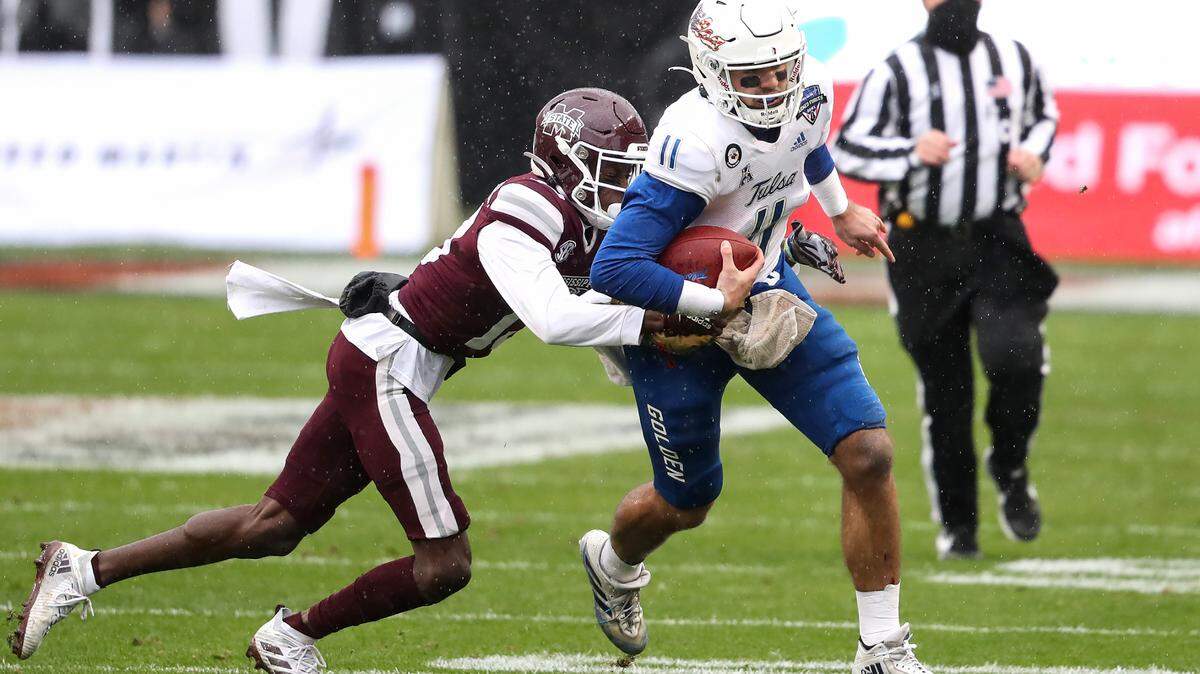 Mississippi State cornerback Emmanuel Forbes attempts to tackle Tulsa quarterback Zach Smith during the Armed Forces Bowl on Thursday, December 31, 2020.