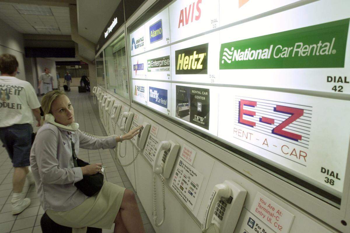 Samantha Ferrie tries to rent a car to continue her trip from Austin to Charlotte, North Carolina, after being grounded at DFW on Sept. 11, 2001