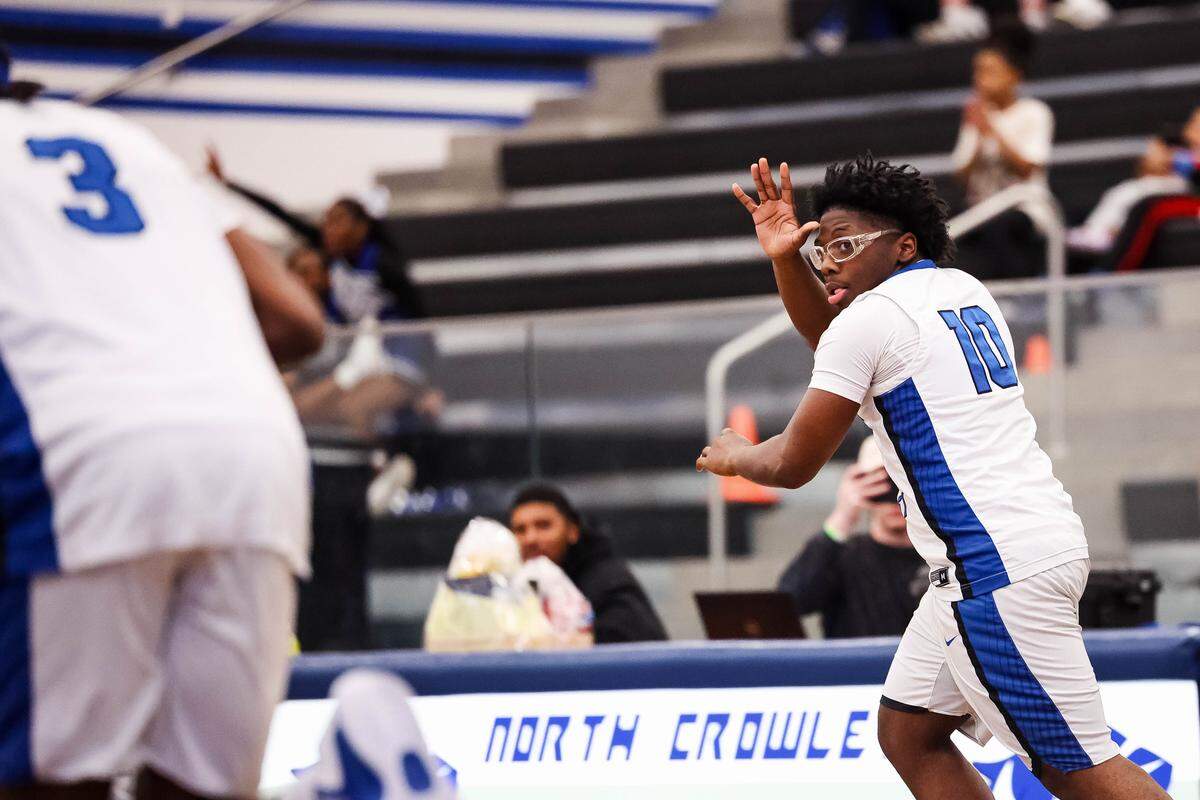 North Crowley guard Billy Crockett celebrates after making a 3-pointer in a District 3-6A matchup against Weatherford on Friday at North Crowley.