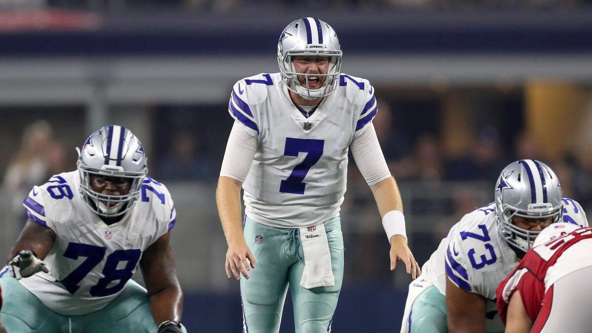 Cowboys quarterback Cooper Rush calls signals against the Cardinals during Sunday’s preseason game at AT&T Stadium.