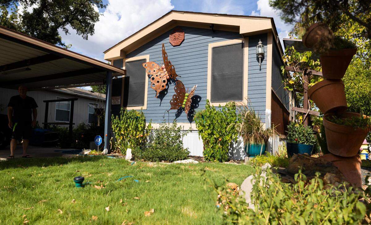 Patrick Teague decorated the outside of his manufactured home with giant butterflies.