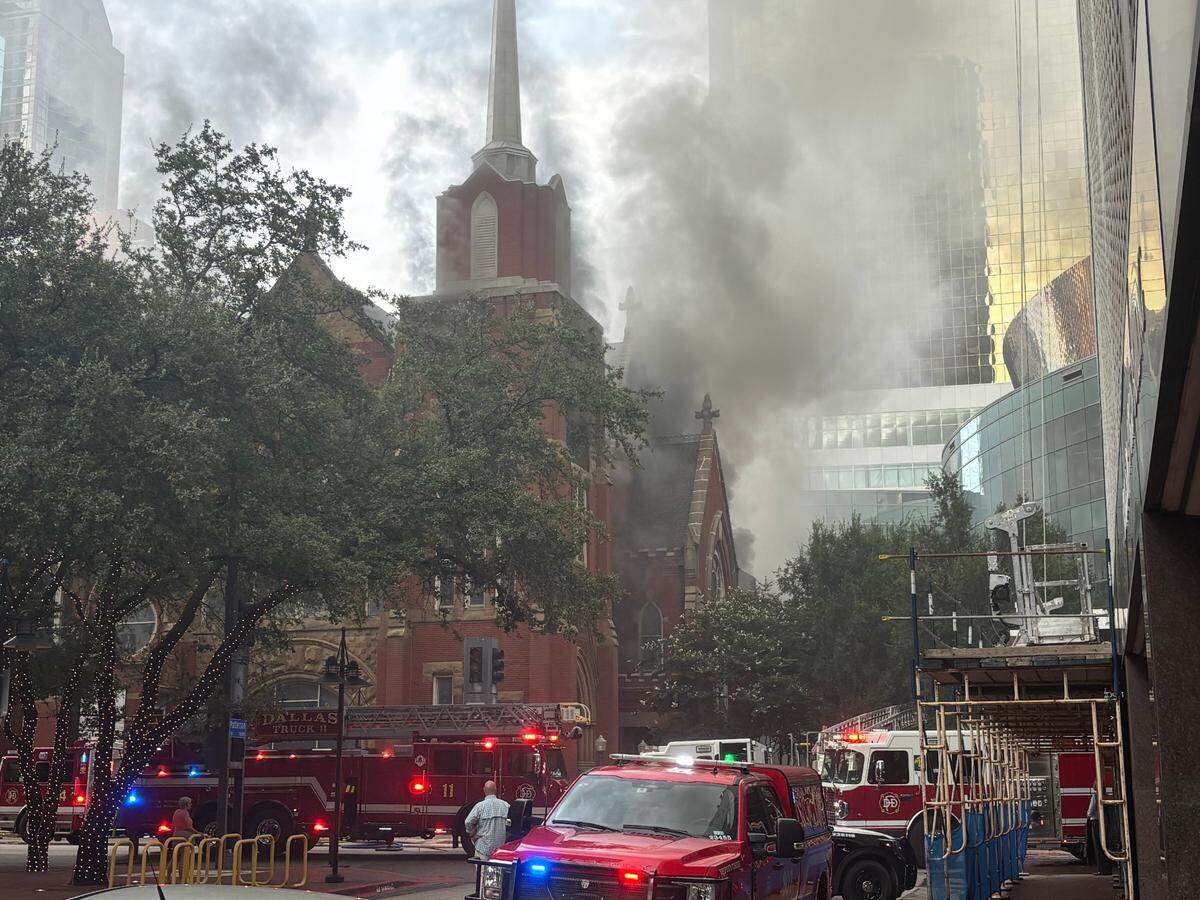 Firefighters battle a church fire at First Baptist Dallas in downtown Dallas on Friday.