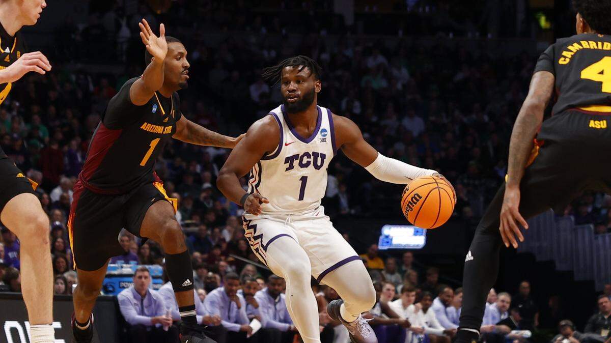 Mar 17, 2023; Denver, CO, USA; TCU Horned Frogs guard Mike Miles Jr. (1) dribbles against Arizona State Sun Devils guard Luther Muhammad (1) during the first half at Ball Arena. Mandatory Credit: Michael Ciaglo-USA TODAY Sports