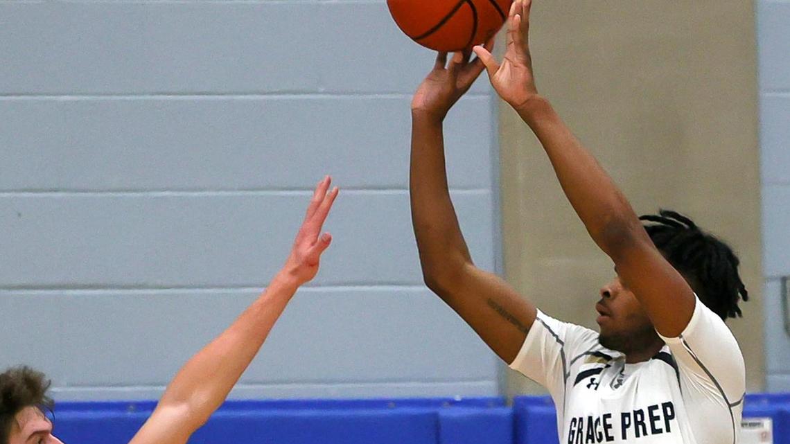 Arlington Grace Prep guard Justin McNelkan shoots over Colleyville Covenant forward Austin Scheets in Saturday’s TAPPS 4A regional game. Grace Prep won 74-66, and advances to the state semifinal on Tuesday. (Steve Nurenberg Special to the Star-Telegram)