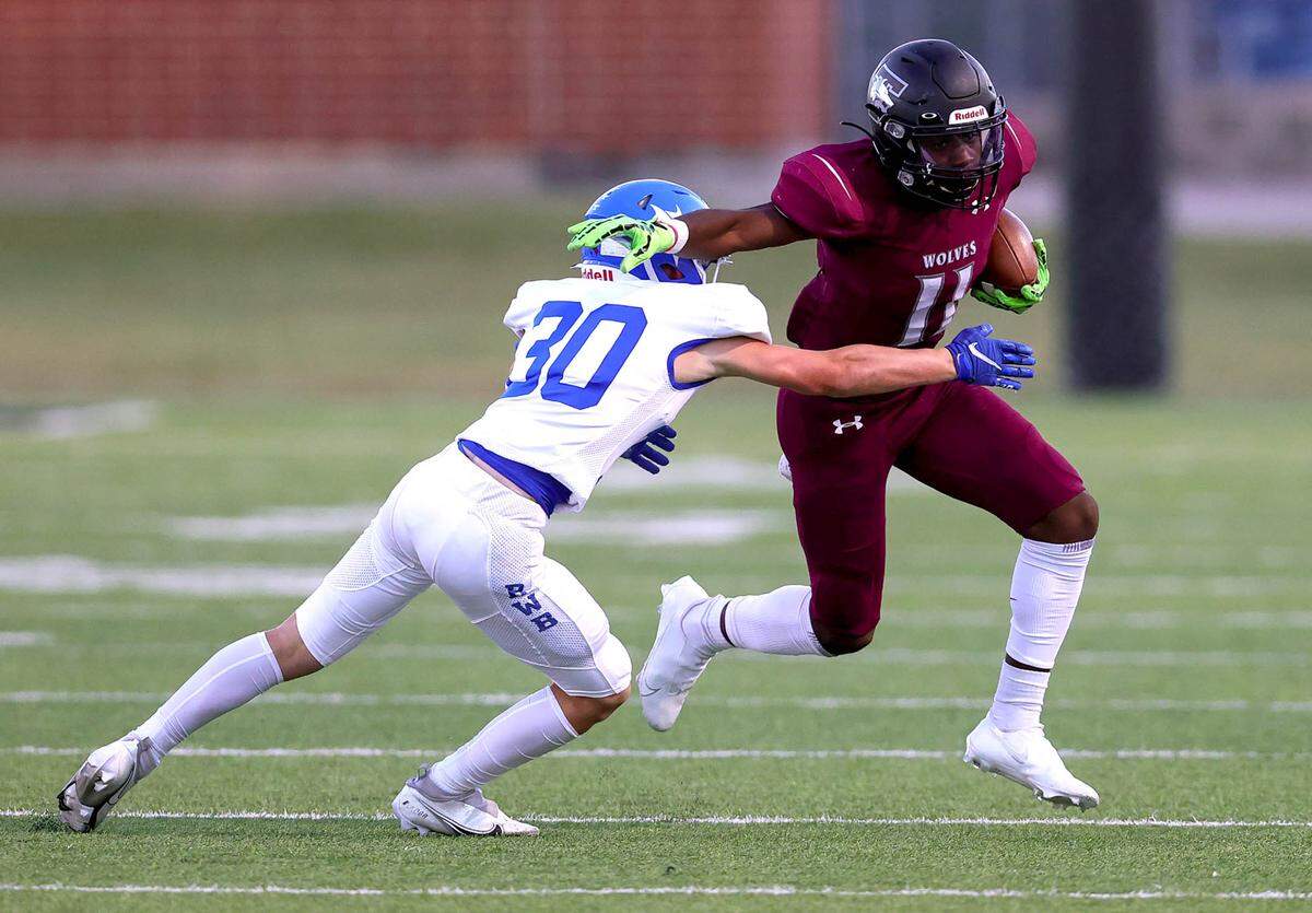 Mansfield Timberview wide receiver Braylon Jones (11) tries to get past Joshua defensive back Tanner Pennell (3) after making a reception during the first half, Thursday night, September 23, 2021 played at Newsom Stadium in Mansfield, TX. (Steve Nurenberg Special to the Star-Telegram)