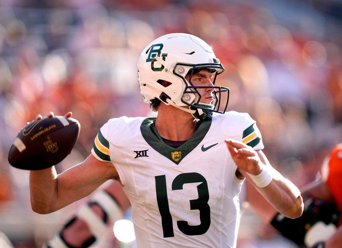 Baylor's Sawyer Robertson (13) throws a pass in the second half of the college football game between the Oklahoma State Cowboys and the Baylor Bears at Boone Pickens Stadium in Stillwater, Okla., Saturday, Sept. 27, 2025.