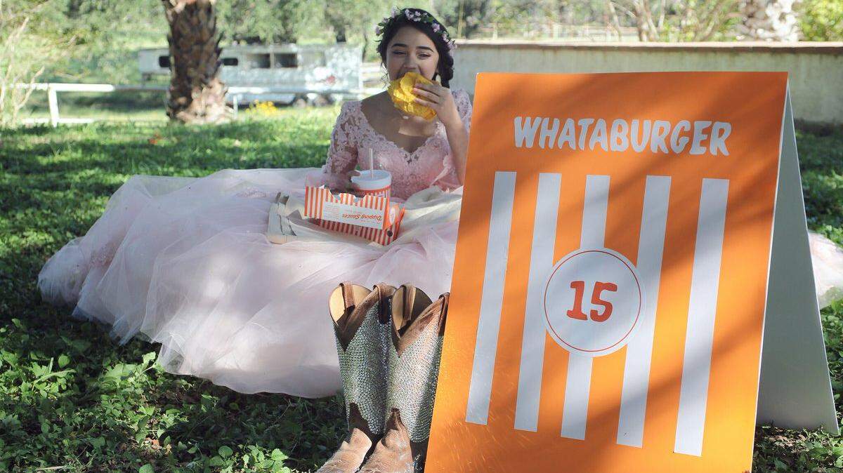 A picture taken as Evelyn Lopez Terrazas of Natalia, in South Texas, took a break from her quinceanera photo shoot to grab a bite to eat has gone viral.