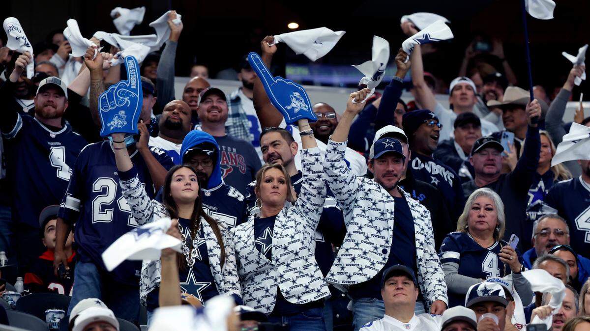 Dallas Cowboys fans cheer during the first half against the Houston Texans at AT&T Stadium.