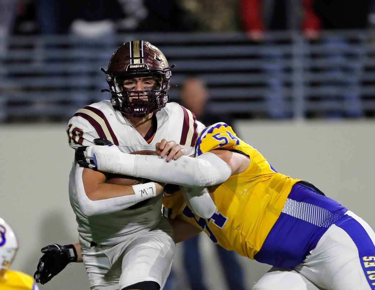 Whitesboro quarterback Mac Harper (10) runs into trouble from Brock lineman Hunter Fay (54) in the first half of a UIL Class 3A D1 Region 1 final football game at C. H. Collins Athletic Complex in Denton, Texas, Thursday, Dec. 01, 2022. Whitesboro led 12-7 at the half. (Special to the Star-Telegram Bob Booth)