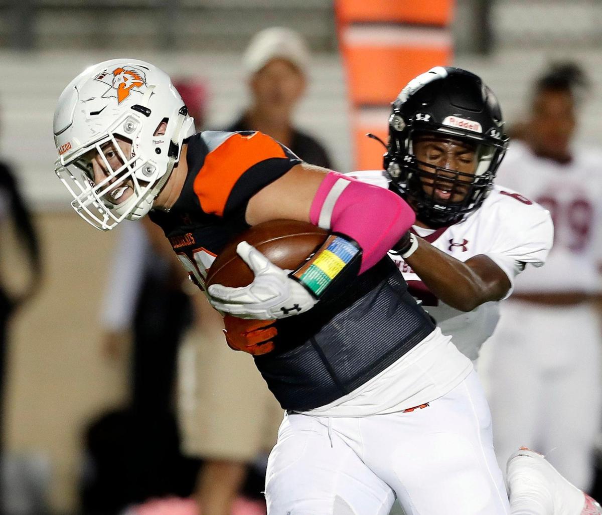 Timberview corner back Toddrick Dixon (6) brings Aledo tight end Jason Llewellyn (89) down after a first down catch in a high school district 5-5A division 2 football game at Bearcat Stadium in Aledo, Texas, Friday Oct. 15, 2021. After a late second quarter Timberview touchdown the score was knotted at 14 at the half. (Special to the Star-Telegram Bob Booth)
