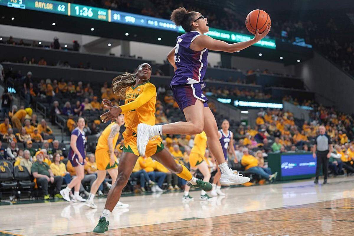 WACO, TEXAS - FEBRUARY 12: Olivia Miles #5 of the TCU Horned Frogs drives to the basket past Kyla Abraham #12 of the Baylor Bears during the second half at Foster Pavilion on February 12, 2026 in Waco, Texas. (Photo by Scott Wachter/Getty Images)