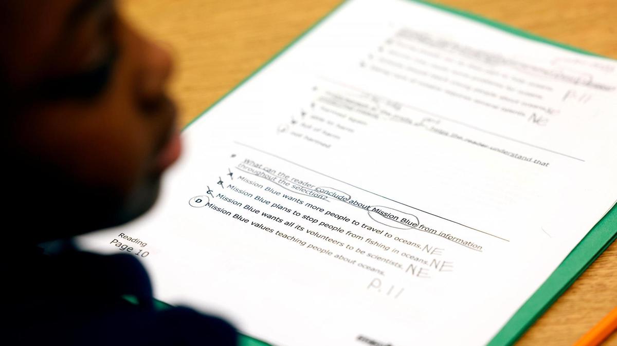 Students work on reading comprehension with retired teacher Wanda Mckenzie at Clifford Davis Elementary School on Feb. 3, 2025, in Fort Worth.