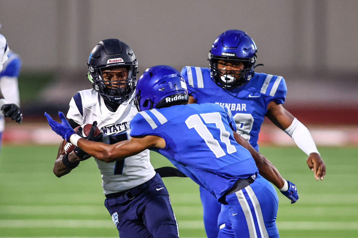 Dunbar defensive back Kingston Clark (17) tackles Wyatt receiver Neiman Griffin (7) on Thursday, September 5, 2024 at Clark Stadium in Fort Worth, Texas. Dunbar rallied to defeat Wyatt 14-13.