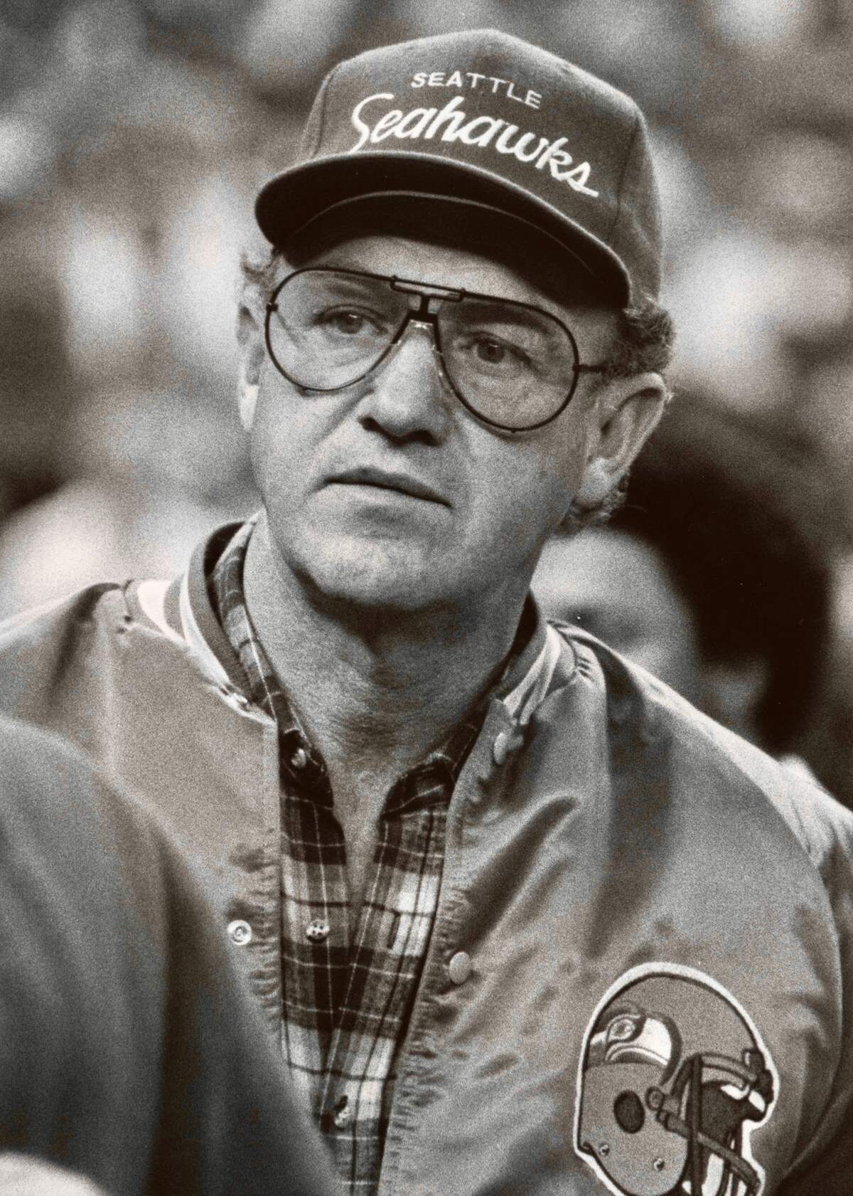 In 1981, Seattle Seahawks fan Gene Hackman watches a game from the sidelines at the Kingdome.
