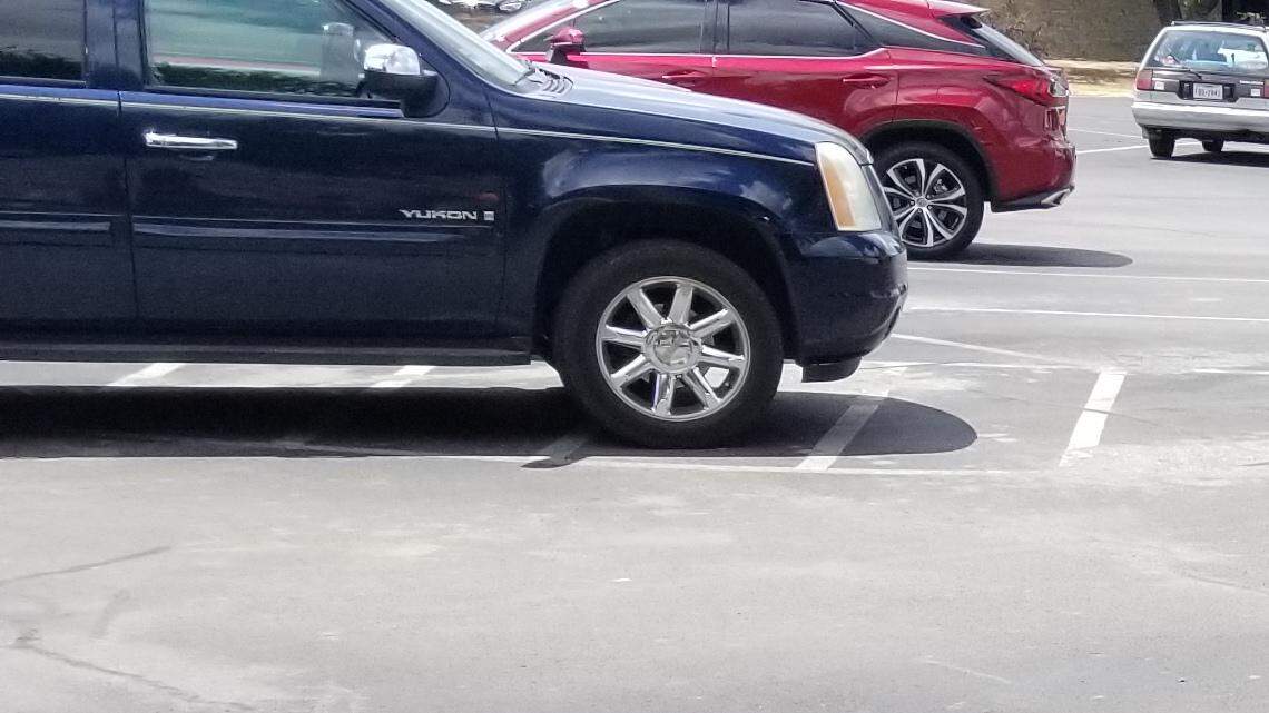 Weatherford food service employee Donna Curry, a volunteer in the free summer lunch program, hands out lunches to youngsters at the Weatherford Public Library.