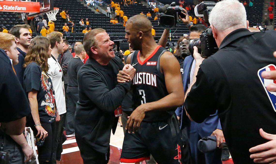 Houston Rockets owner Tilman Fertitta congratulates Houston Rockets guard Chris Paul (3) following their NBA basketball game against the Utah Jazz Saturday, April 20, 2019, in Salt Lake City. (AP Photo/Rick Bowmer)
