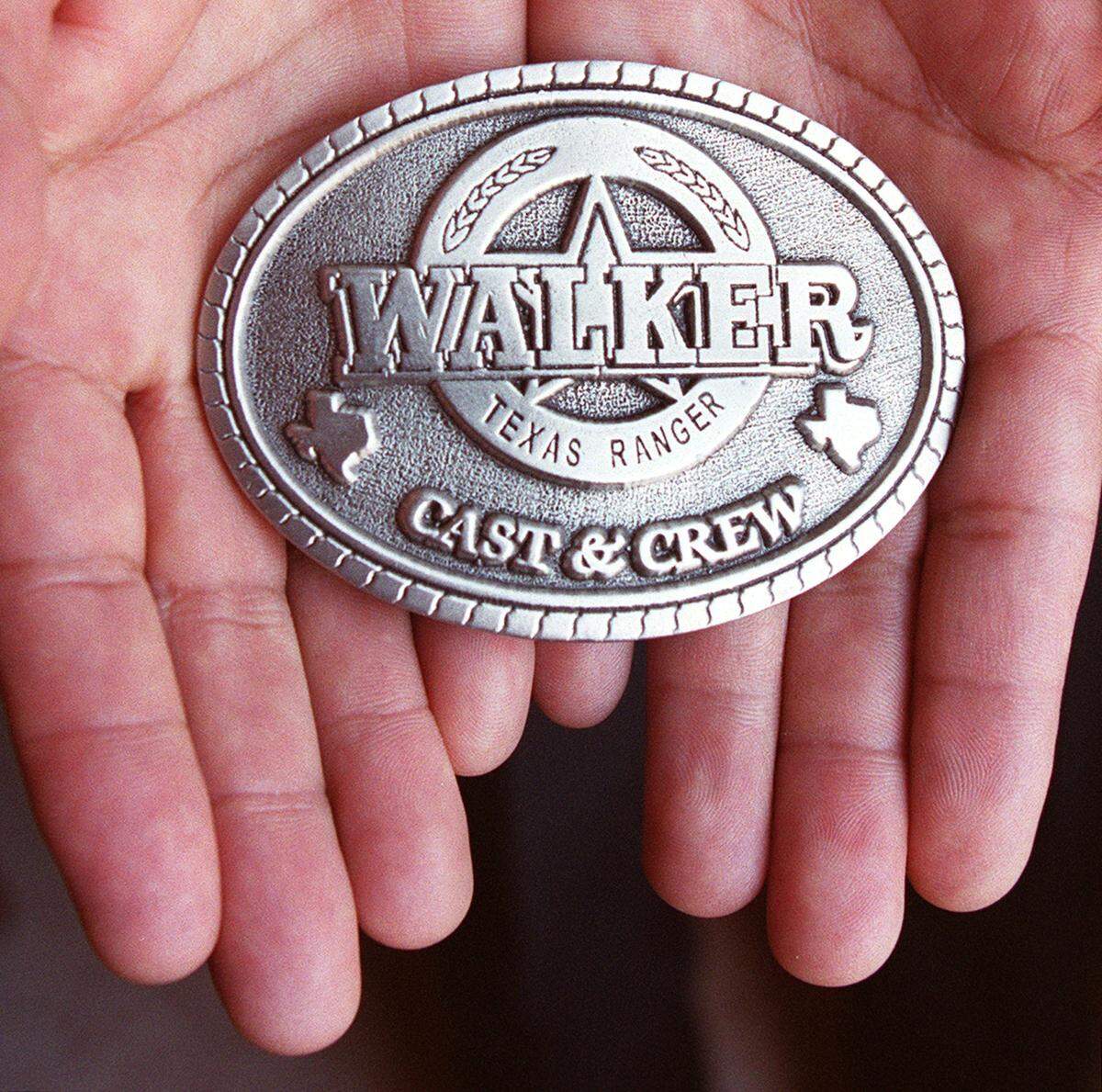Rey Olivas created thousands of unique belt buckle designs, including the badges and buckles used in Walker Texas Ranger. Photo shot at his office in Fort Worth on Tuesday, February 19, 2002.