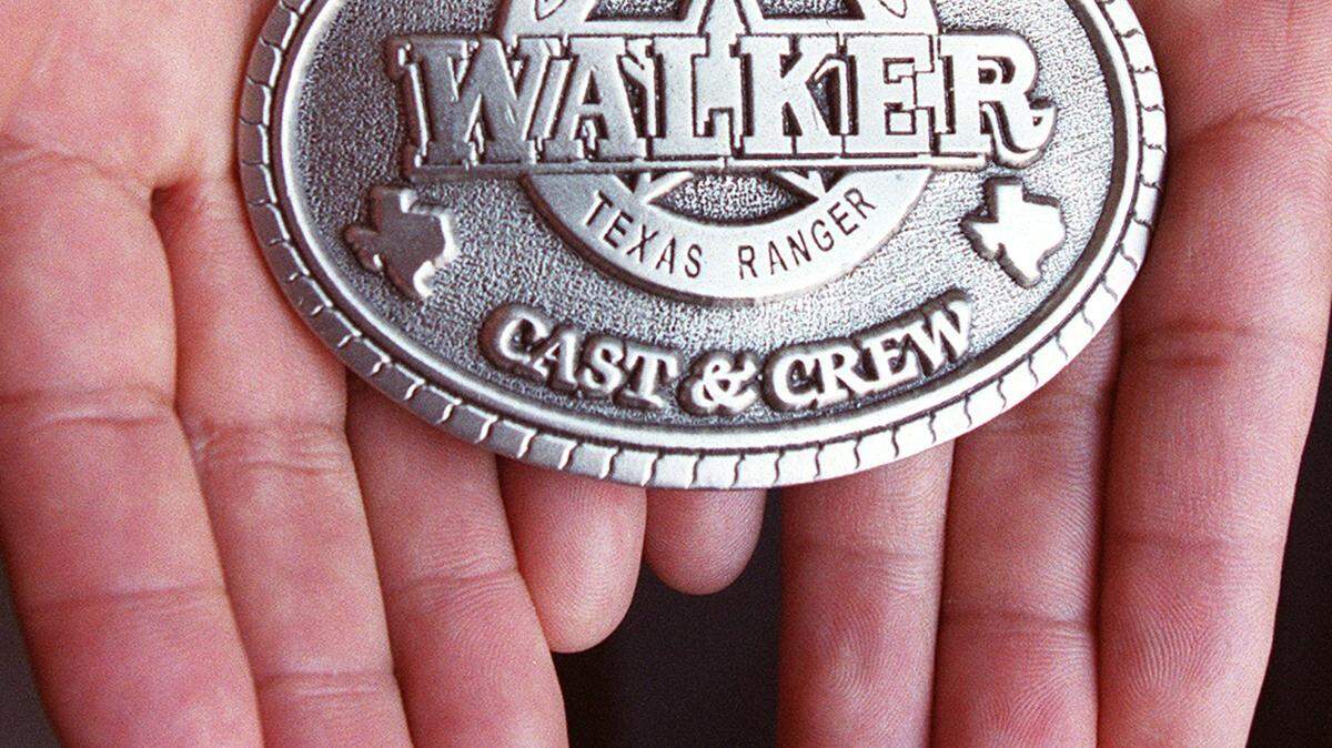 Rey Olivas created thousands of unique belt buckle designs, including the badges and buckles used in Walker Texas Ranger. Photo shot at his office in Fort Worth on Tuesday, February 19, 2002.
