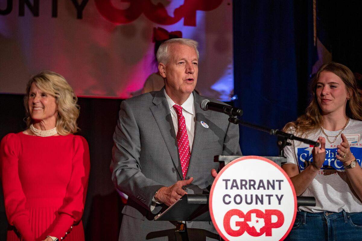 Candidate Phil Sorrells acknowledges he is ahead in the race for District Attorney during the Tarrant County GOP watch party with his family behind him on Tuesday, Nov. 8, 2022 at the Ashton Depot in Fort Worth.