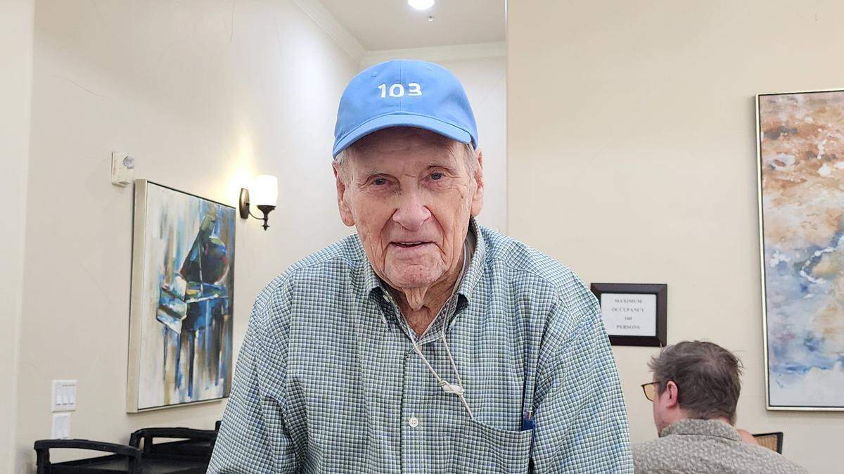 World War II veteran Art Watson, who survived 18 days adrift at sea after his ship was torpedoed by Nazis, turned 103 years old on Aug. 27 and wears a hat to celebrate the occasion.