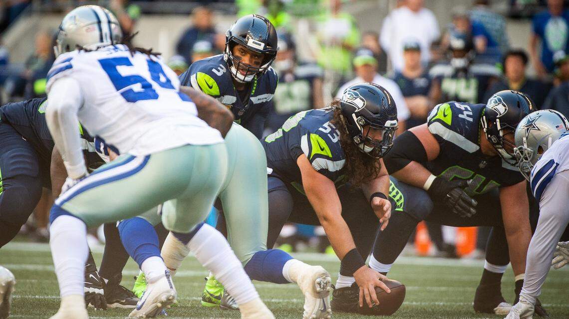 Seahawks quarterback Russell Wilson works the line in the fourth quarter. The Seattle Seahawks played the Dallas Cowboys in a NFL football game at CenturyLink Field in Seattle, Wash., on Sunday, Sept. 23, 2018. 
