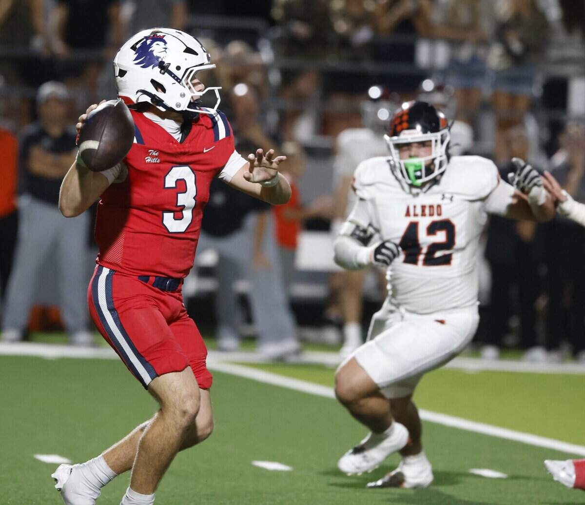 North Richland Hills Richland quarterback Brett Kates (3) is pressured by Aledo defensive end Cooper Cyphers (42) into an incomplete pass during the first half of a UIL football game on Thursday, October, 23, 2025 at Birdville FAAC Stadium in North Richland Hills, Texas.