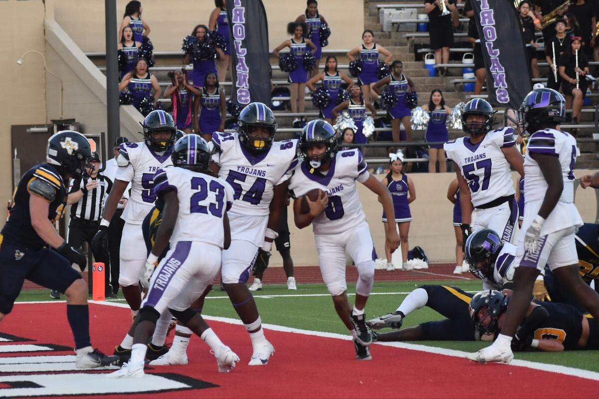 Waco University’s quarterback Cade Bynnom (8) scores the first touchdown of the night during a high school football game against Arlington Heights at Farrington Field in Fort Worth, Texas Thursday, September 7, 2023.