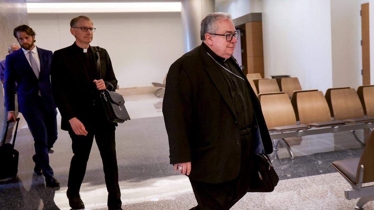 Biship Micheal Olson enters the 67th District Court in June for a hearing on a lawsuit.